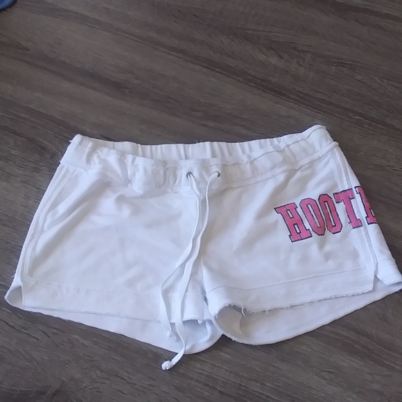 White raw hem drawstring Hooter shorts.